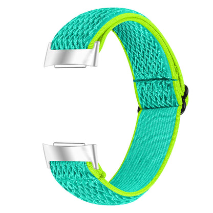 Elastic nylon strap for Fitbit Charge 6 in vibrant turquoise and green, ideal for sport and style.
