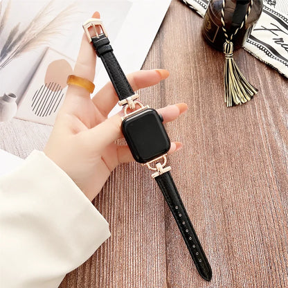 Apple Watch Genuine Leather Strap displayed on hand, showcasing classic black design and elegant buckle detail.