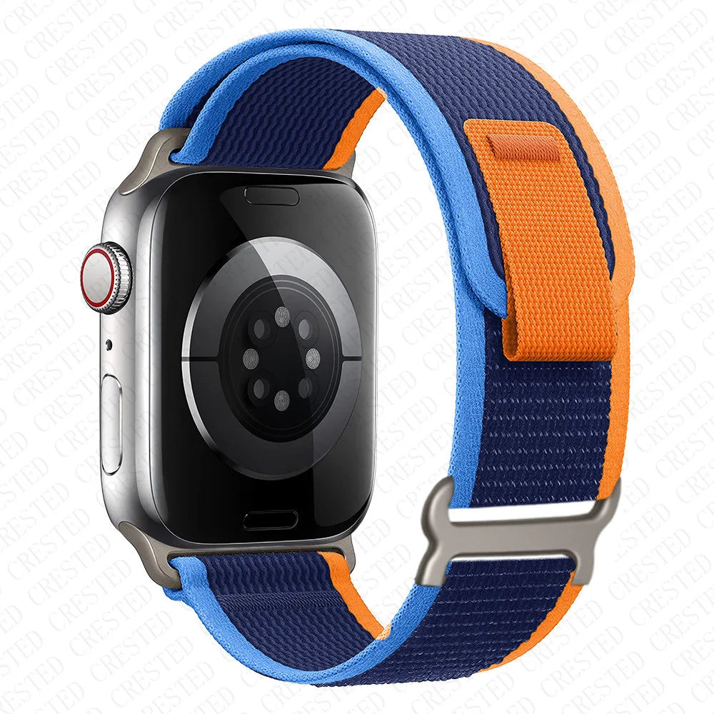 Apple Watch with Trail Loop Nylon Strap in blue and orange, lightweight and breathable for all-day comfort.