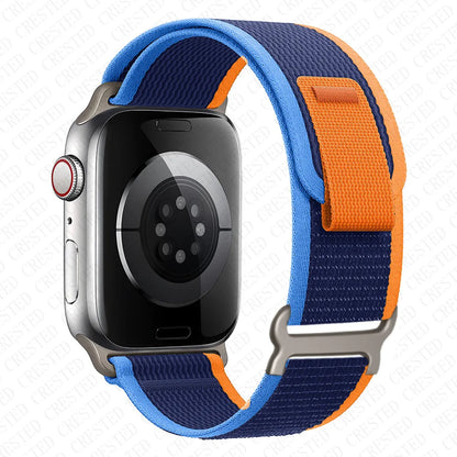 Apple Watch with Trail Loop Nylon Strap in blue and orange, lightweight and breathable for all-day comfort.