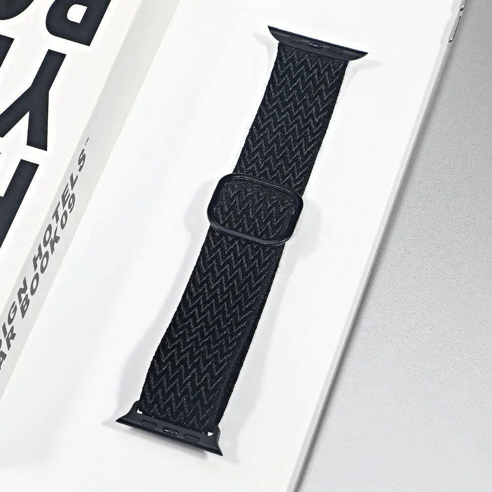 Apple Watch nylon sport loop strap in black, featuring a breathable design for added comfort and versatility.