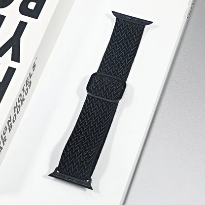 Apple Watch nylon sport loop strap in black, featuring a breathable design for added comfort and versatility.