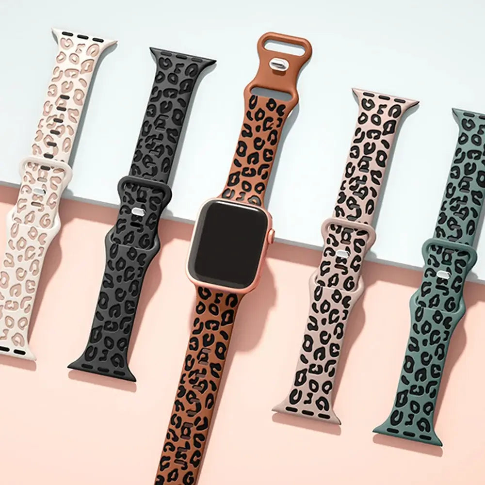 Leopard-pattern silicone Apple Watch straps displayed in assorted colors