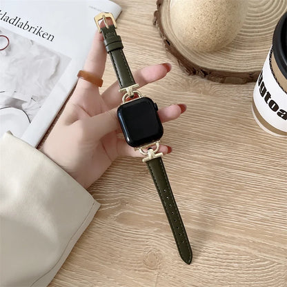 Apple Watch with green genuine leather strap, showcasing a stylish yet durable design on a wooden table.