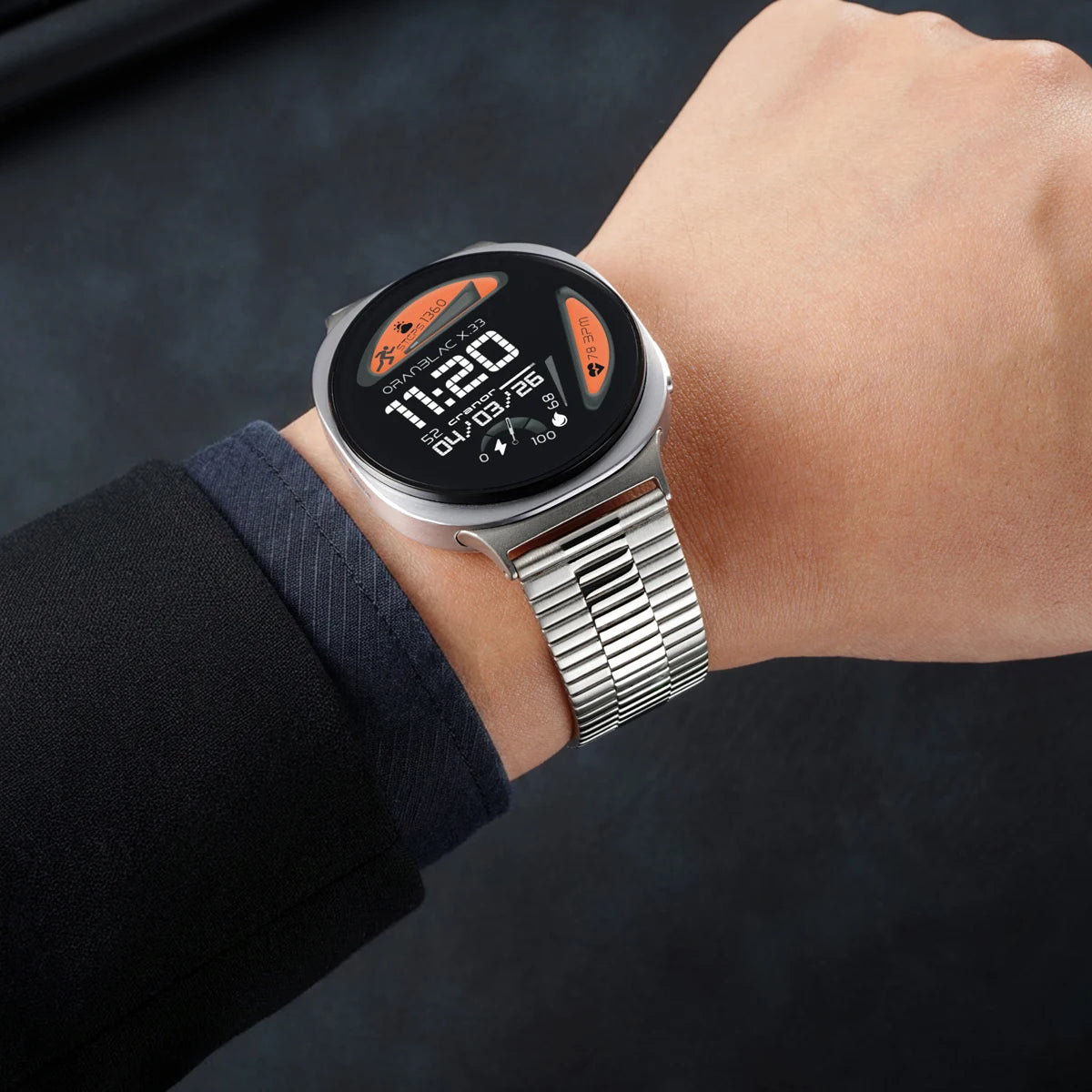 Samsung Galaxy Stainless Steel Link Watch Band - Watch8/Watch8 Classic/Watch9 Business on a wrist in a formal setting.