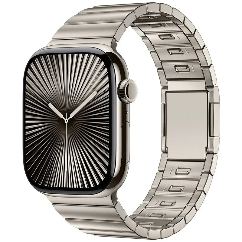 Apple Watch with stainless steel band and magnetic buckle, featuring a sleek black face and polished finish.