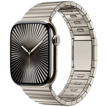 Apple Watch with stainless steel band and magnetic buckle, featuring a sleek black face and polished finish.