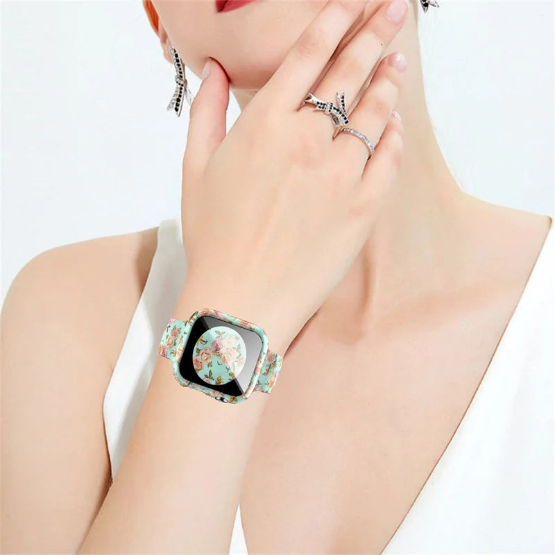 Stylish Apple Watch Silicone Strap with unique printed floral design worn on a hand adorned with rings.