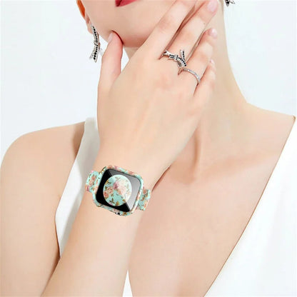 Stylish Apple Watch Silicone Strap with unique printed floral design worn on a hand adorned with rings.