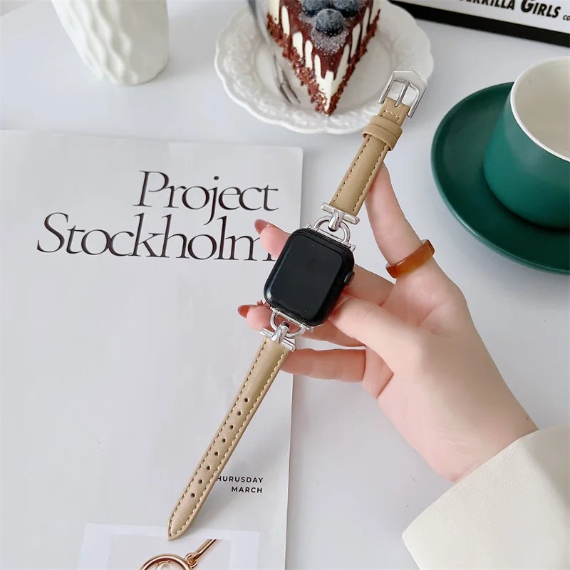 Apple Watch Genuine Leather Strap on a table, showcasing its elegant design and adjustable fit.