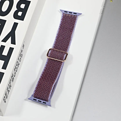 Apple Watch nylon sport loop strap in purple with gold buckle, perfect for style and comfort during workouts and daily wear.