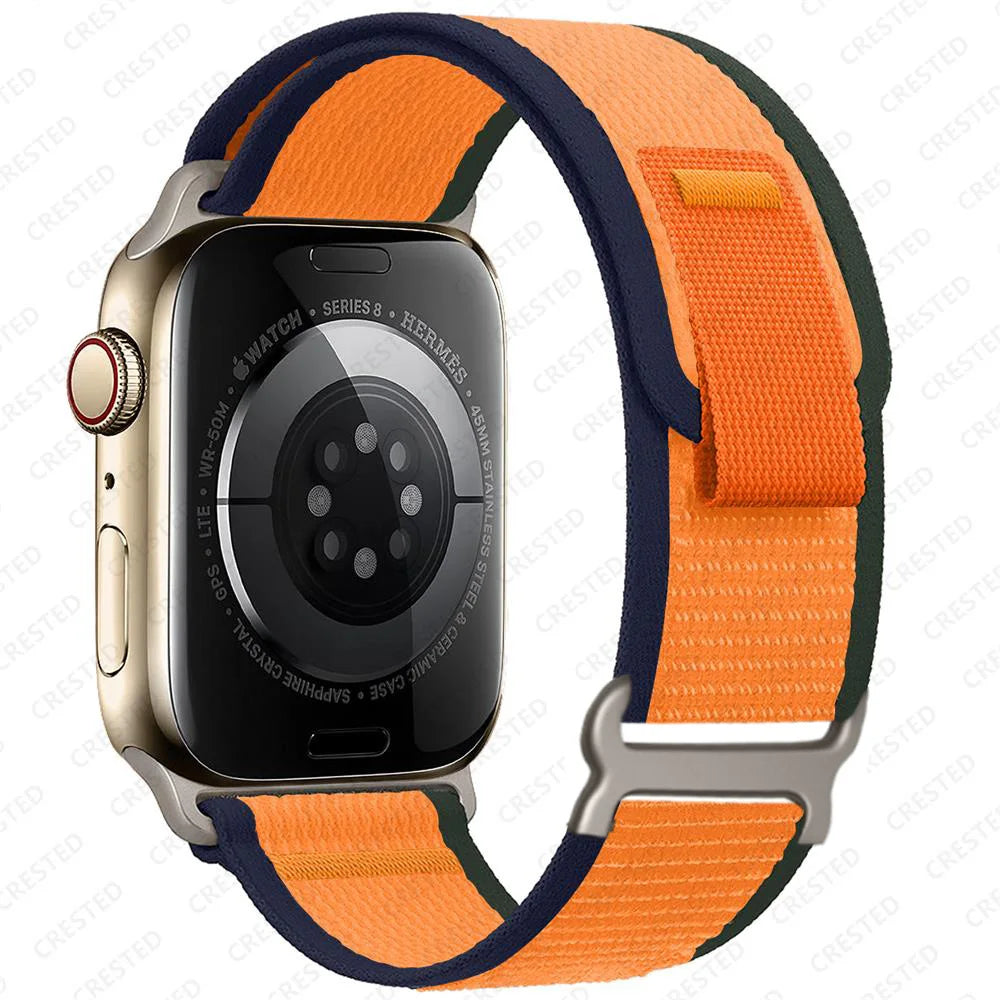 Apple Watch Trail Loop Nylon Strap in orange and navy, durable and breathable for comfort during outdoor activities.