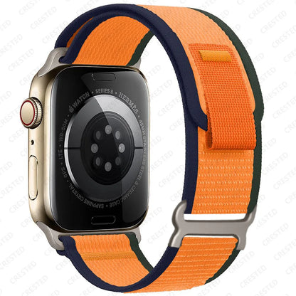 Apple Watch Trail Loop Nylon Strap in orange and navy, durable and breathable for comfort during outdoor activities.