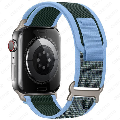 Apple Watch with Trail Loop Nylon Strap in blue and green, perfect for comfort and durability during everyday and outdoor activities.