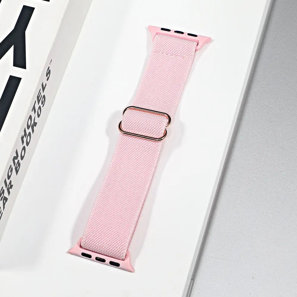Apple Watch nylon sport loop strap in pink with rose gold buckle, breathable and stylish for workouts and daily wear.
