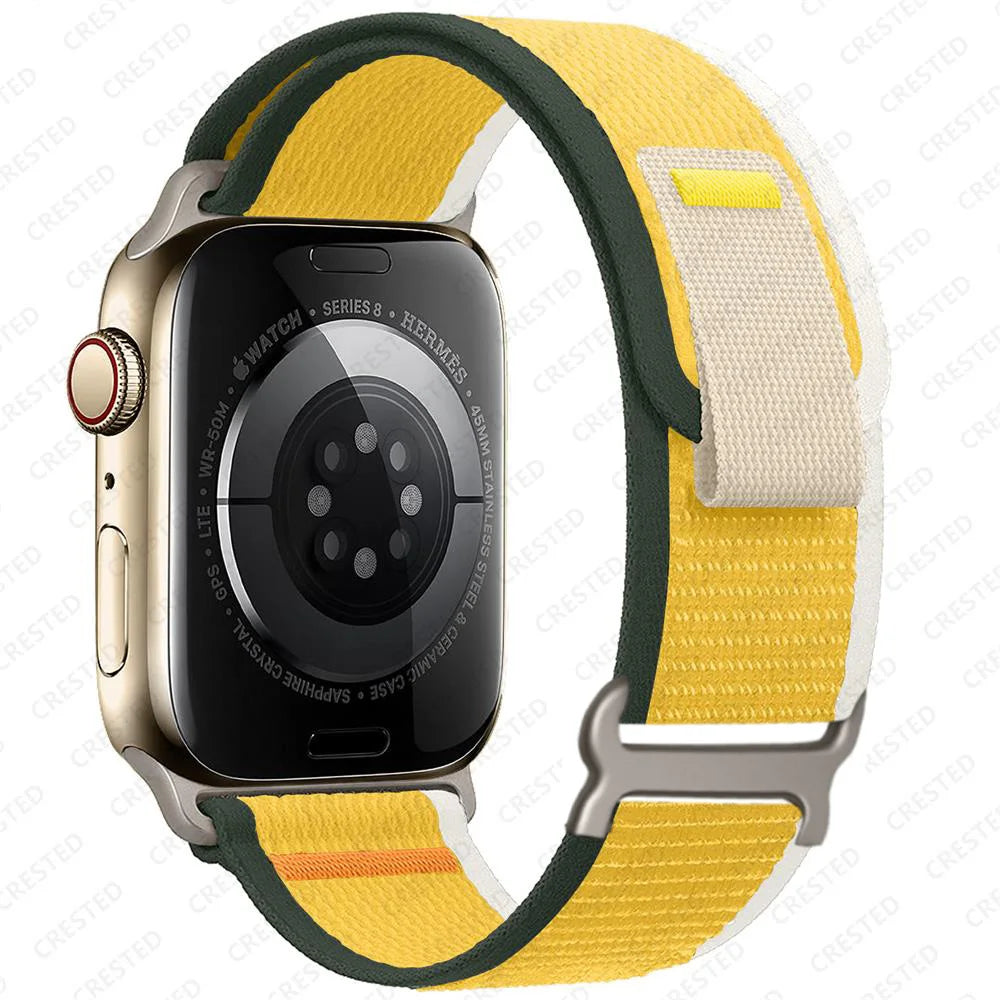 Apple Watch with Trail Loop nylon strap in yellow and green, featuring a durable and adjustable design for all-day comfort.