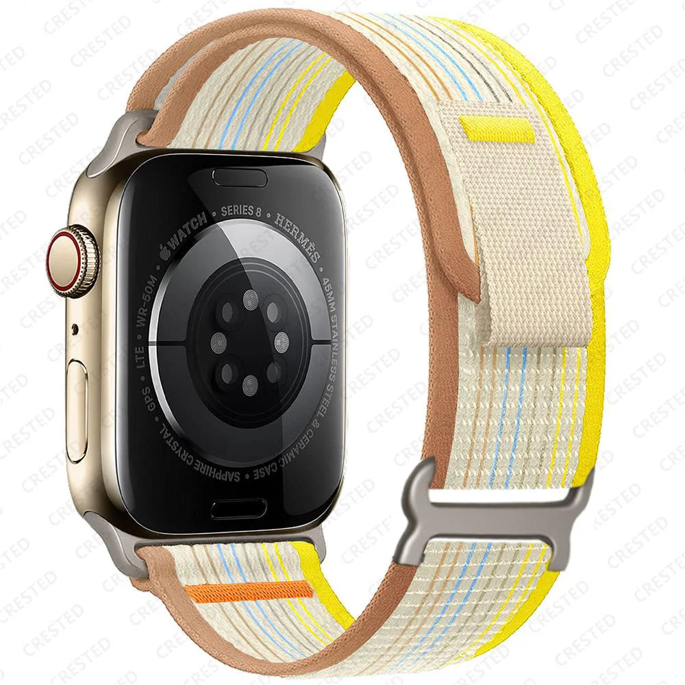 Apple Watch with Trail Loop Nylon strap, featuring a yellow and brown design, showcasing comfort and versatility.