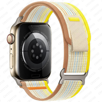 Apple Watch with Trail Loop Nylon strap, featuring a yellow and brown design, showcasing comfort and versatility.