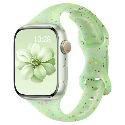 Apple Watch with colorful silicone band featuring a soft green design and playful speckles, ideal for comfort and style.