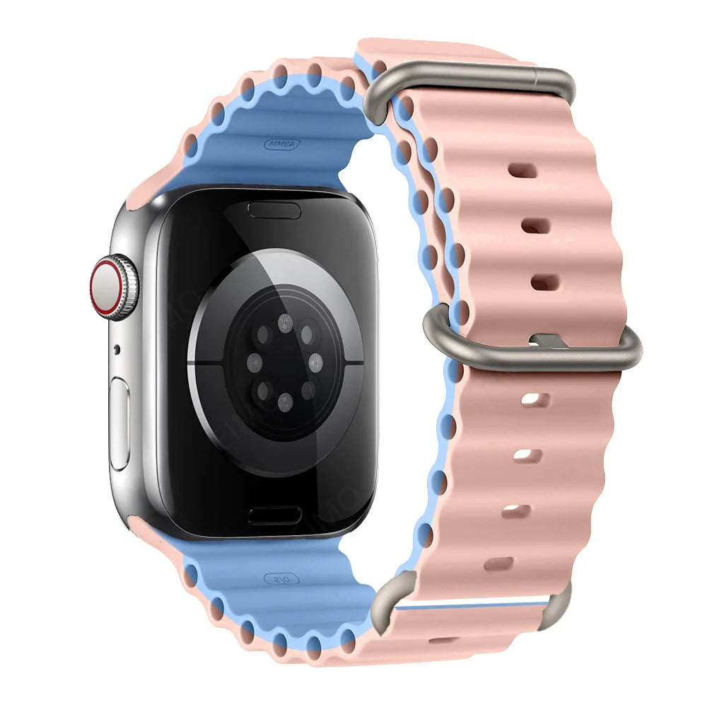 Apple Watch with pink and blue silicone strap, waterproof and breathable for comfort and active lifestyles.