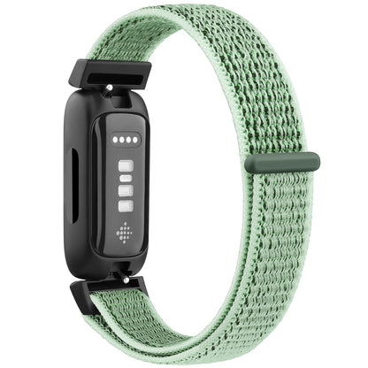 Fitbit Inspire 3 with adjustable mint green nylon strap, designed for comfort and style, perfect for everyday wear.