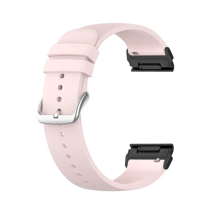 Garmin silicone smartwatch band in soft pink with quickfit connectors for secure attachment and flexibility.