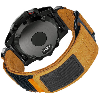 Back view of Garmin smartwatch with durable leather strap, showing quickfit band attachment and vibrant orange detail.