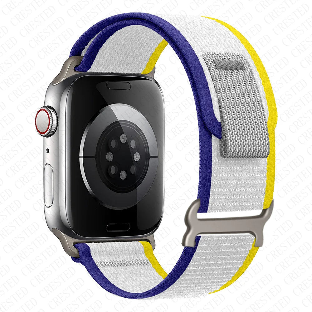 Close-up of Apple Watch with Trail Loop Nylon Strap in blue, white, and yellow, highlighting durability and comfort.