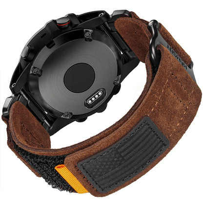 Garmin smartwatch on a brown suede strap showing durable clasp and back design for style and comfort.