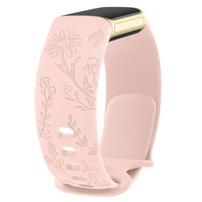 Stylish pink silicone flower engraved strap for Fitbit Charge 5 and Charge 6, adding elegance to your smartwatch.