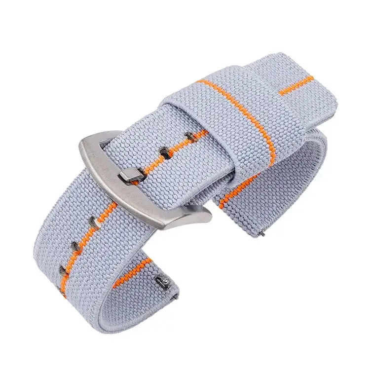 Lightweight nylon Suunto watch band in gray with orange stripes, offering comfort and minimal bulk for outdoor enthusiasts.