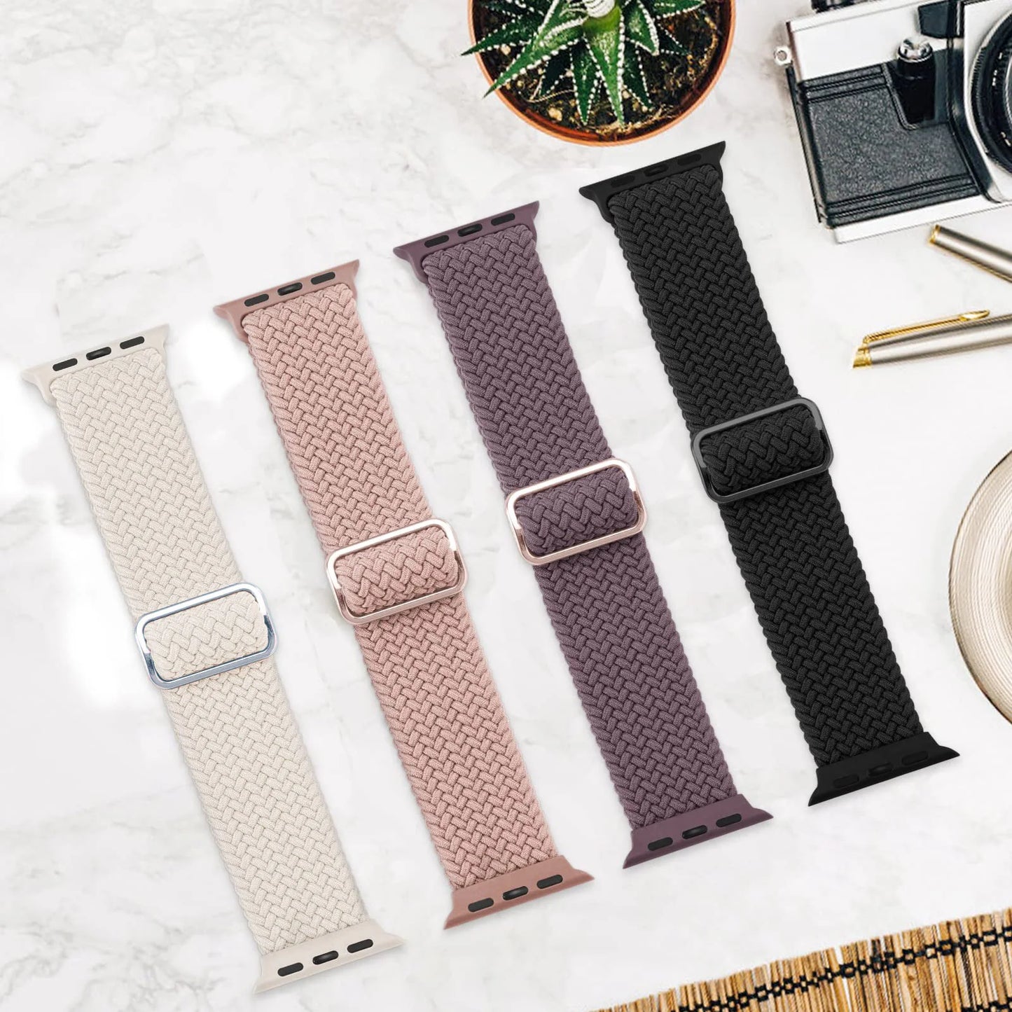 Apple Watch Braided Straps in four colors: cream, pink, purple, and black on a stylish background.