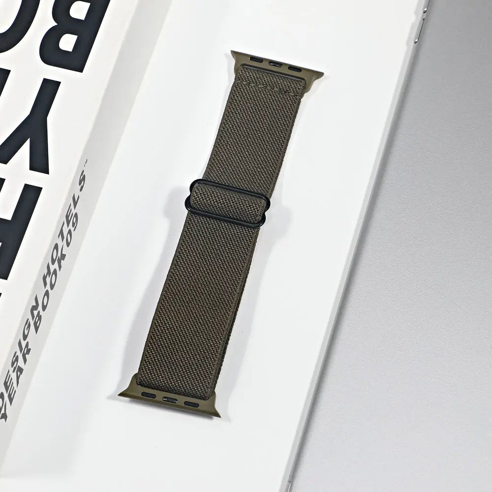 Apple Watch nylon sport loop strap in olive color, featuring breathable fabric for comfort and versatile styling.