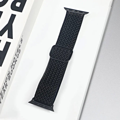 Black nylon sport loop strap for Apple Watch, breathable and comfortable for daily wear and workouts.
