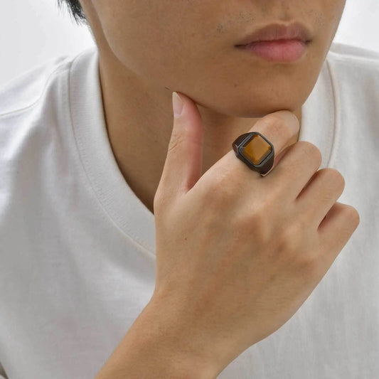 Man wearing square tiger's eye ring