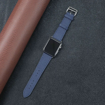 Apple Watch Fabric Band in navy blue laid on leather background, showcasing its durable and stylish design.