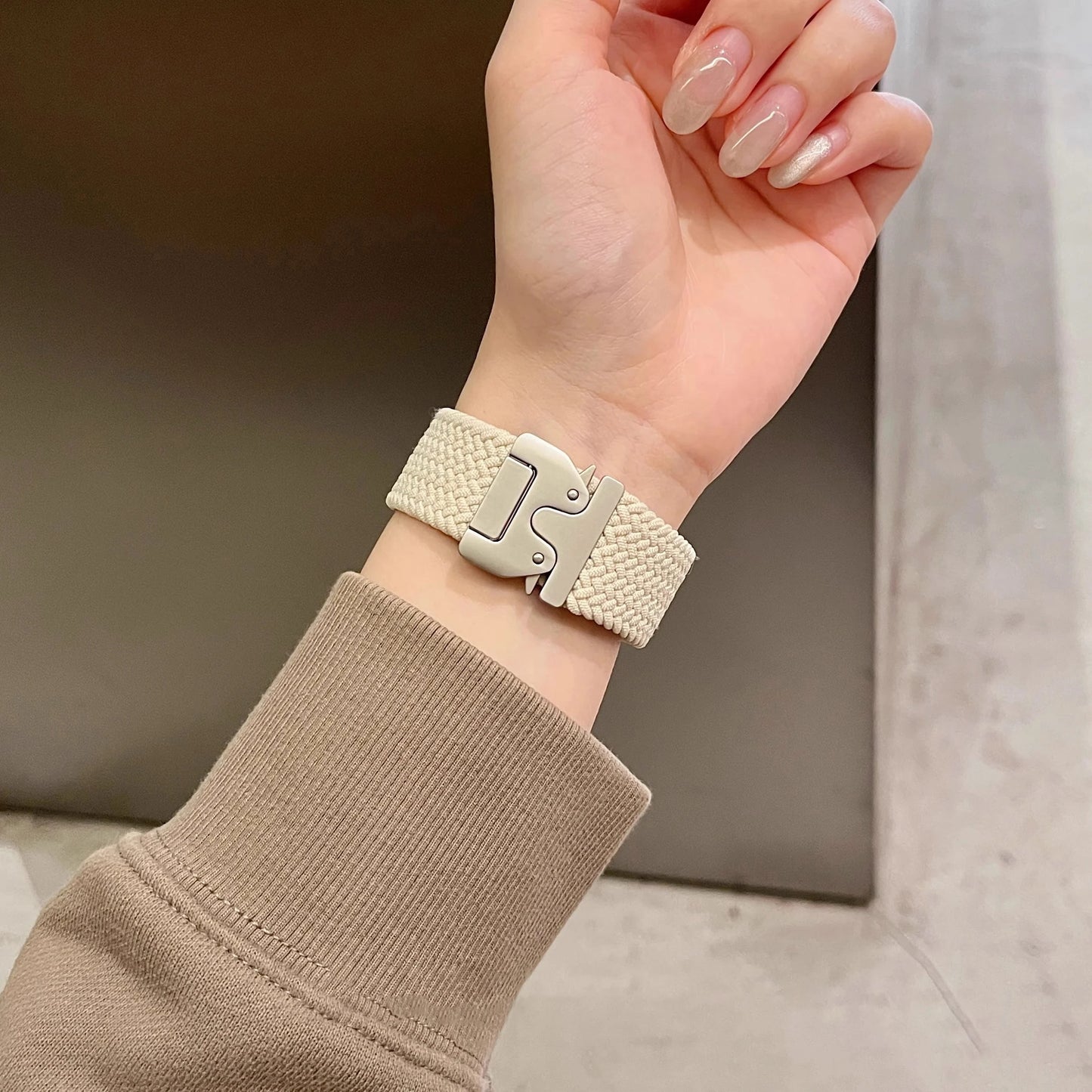 Apple Watch Parachute Strap in braided nylon, worn on a wrist, showcasing its breathable and stylish design.