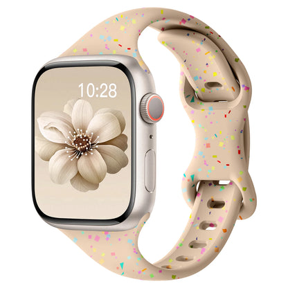 Apple Watch with a soft silicone band featuring a colorful speckled design, perfect for all-day comfort and style.