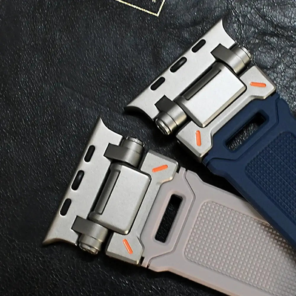 Close-up of metal connectors on navy and beige silicone straps