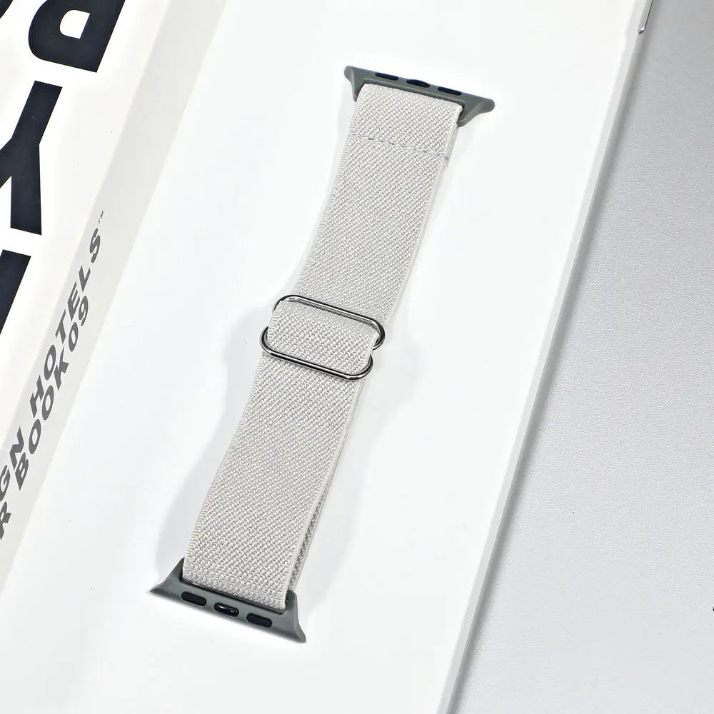 Apple Watch nylon sport loop strap in light gray, showcasing breathable and comfortable design for daily wear and workouts.