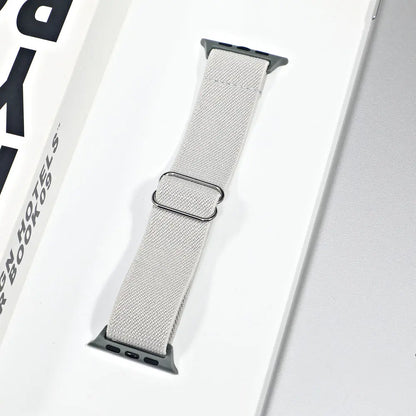 Apple Watch nylon sport loop strap in light gray, showcasing breathable and comfortable design for daily wear and workouts.