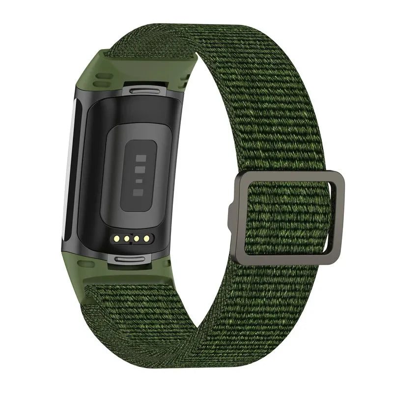 Fitbit Charge 5 with elastic nylon loop band in green, designed for comfort and durability during workouts and daily wear.