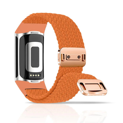 Braided band for Fitbit Charge 5 and 6 in orange with magnetic buckle, combining style and comfort for smartwatch wear.