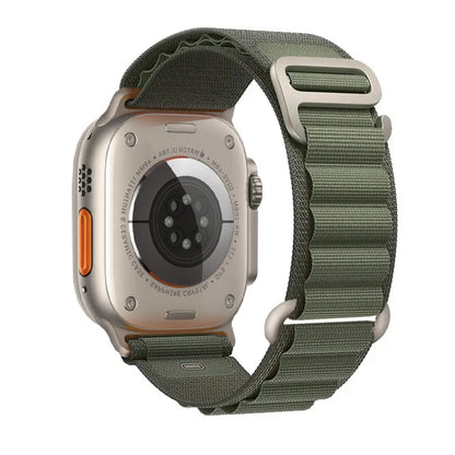 Apple Watch with Rugged Alpine Loop Nylon Strap in green, showcasing durable design and comfort for outdoor use.