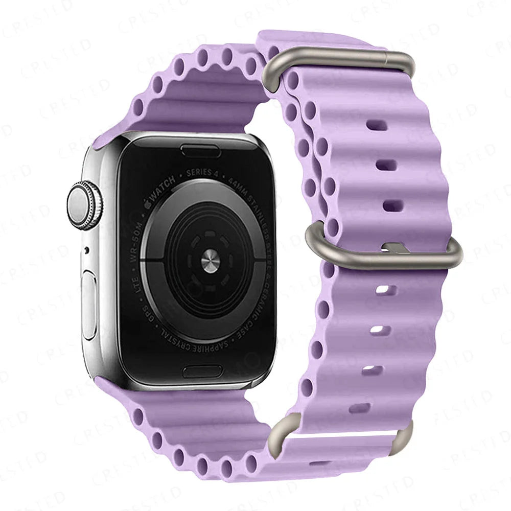 Apple Watch with purple silicone strap, featuring a breathable and waterproof design for active lifestyles.