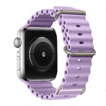 Apple Watch with purple silicone strap, featuring a breathable and waterproof design for active lifestyles.