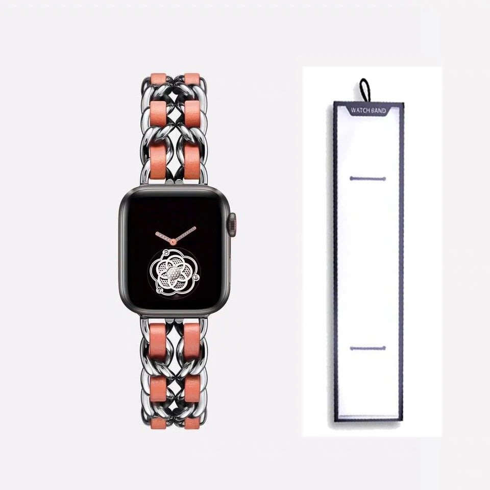 Silver chain bracelet with orange accents, shown beside packaging for Apple Watch