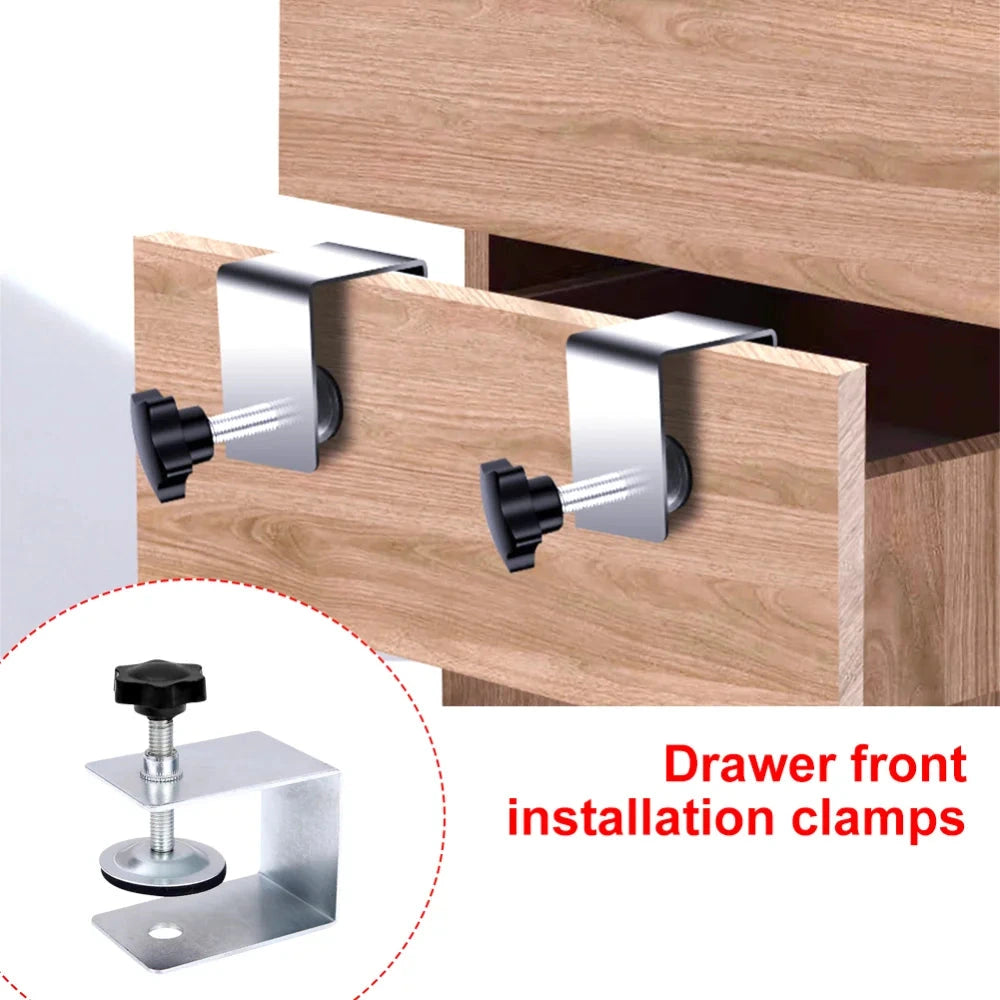 Drawer front installation clamps holding a drawer front to the drawer box