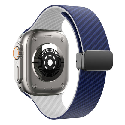 Apple Watch with blue silicone strap and magnetic buckle, showcasing durable design and stylish appearance.