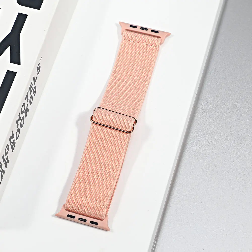 Apple Watch nylon sport loop strap in soft peach, perfect for stylish comfort and versatile wear.
